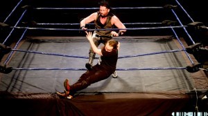 Toby Michaels getting the worst side of Jack Jester at the first Rock N Wrestle